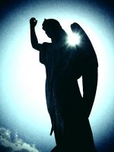 Angel raising a fist. Image via Neil Lang/shutterstock.com