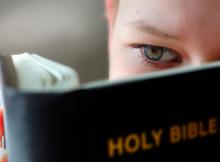 10-11 years boy reading the holy bible. Mikael Damkier / Shutterstock Mikael Damkier / Shutterstock