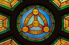 Stained glass illustration of the Holy Trinity, Nancy Bauer / Shutterstock.com