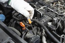 Mechanic performing the maintenance of a motor vehicle. Photo via Shutterstock/fotoedu