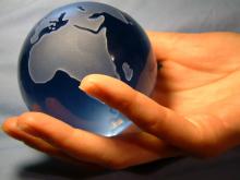 Globe in hand,  Magdalena Bujak / Shutterstock.com