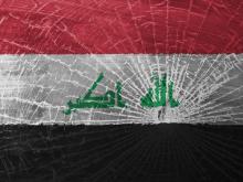 The Iraqi flag, shattered. Image courtesy MyImages - Micha/shutterstock.com