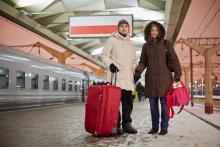 A man and a woman hold hands near a train. Image courtesy Pavel L Photo and Video/shutterstock.com A man and a woman hold hands near a train. Image courtesy Pavel L Photo and Vide
