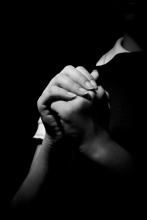 A woman praying. Jesus Cervantes / Shutterstock Jesus Cervantes / Shutterstock