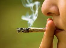 A woman smoking marijuana. Photo courtesy of Stanimir G.Stoev via Shutterstock.