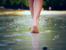 A woman walking on sand. Image courtesy Nikolay Bassov/shutterstock.com. A woman walking on sand. Image courtesy Nikolay Bassov/shutterstock.com.