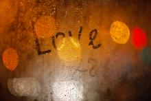 'Love' written on window in the rain, Wolf__ / Shutterstock.com 'Love' written on window in the rain, Wolf__ / Shutterstock.com