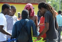 Men pray after Officer Darren Wilson's name released in Ferguson, Mo., Aug. 15, 2014. R. Gino Santa Maria / Shutterstock.com R. Gino Santa Maria / Shutterstock.com