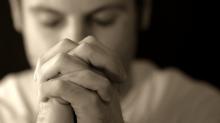 Man Praying, Kevin Carden/Shutterstock.com