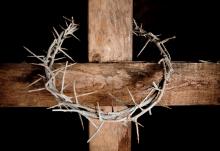Crown of thorns hung around Easter cross, Anneka/Shutterstock.com