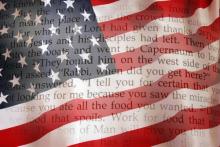 Bible on an American flag. Image courtesy Sergey Kamshylin/shutterstock.com