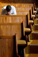 Praying image via Shutterstock