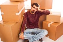 Man among moving boxes, William Perugini / Shutterstock.com Man among moving boxes, William Perugini / Shutterstock.com