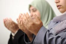 Muslim women holding their hands out. Photo courtesy ZouZou/ Shutterstock.com. Photo courtesy ZouZou/ Shutterstock.com.