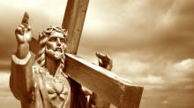 Jesus holding the cross, Kobets / Shutterstock.com