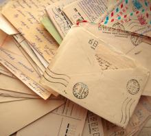 Photo of pile of letters, Kudryashka / Shutterstock.com