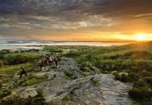 Pilgrims ascending at sunrise Croagh Patrick mountain, Westport, Co. Mayo, Ireland. Getty Images. Pilgrims on Croagh Patrick mountain, Westport, Co. Mayo, Ireland. Getty Images.
