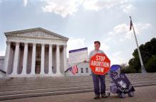 An anti-abortion protester holds in front of the U.S. Supreme Court in 2001. Photo by Ryan Rodrick Beiler / Shutterstock / RNS Photo by Ryan Rodrick Beiler / Shutterstock / RNS