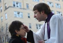 Mary Jo Binker of Rosslyn, Va., receives ashes from the Rev. Kyle Oliver on Ash Wednesday, 2014. RNS photo by Adelle M. Banks.