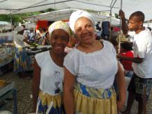 Juliana Lima and Jenifer Felicio, Candomble young women, pose for a photograph. Photo via RNS/by Robson Coelho