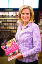 Ann Romney holds a copy of her latest book. Photo via RNS/by Josh Morgan, Orange County Register