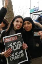Amina Tadjouri, right, with a friend in Paris during a demonstration on Jan. 11. Photo via Elizabeth Bryant / RNS Photo via Elizabeth Bryant / RNS