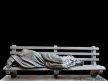 “Homeless Jesus” depicts the Christian savior huddled beneath a blanket on a park bench. Photo: courtesy Timothy Schmalz/RNS.