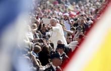 Pope Francis waves in St. Peter’s Square at the Vatican on April 15, 2015. Photo via REUTERS / Alessandro Bianchi / RNS Photo via REUTERS / Alessandro Bianchi / RNS