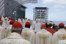 Cardinals stand nearby as Pope Francis celebrates the closing Mass of World Yout