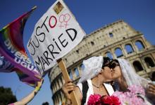 A lesbian couple kiss during the annual gay pride parade in downtown Rome on June 15, 2013. Photo via REUTERS / Max Rossi / RNS Photo via REUTERS / Max Rossi / RNS