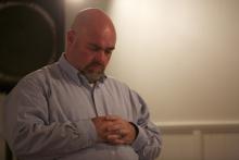 Pastor Jamie Coots prays during a service in Middlesboro, Ky. Photo courtesy National Geographic Channel / RNS