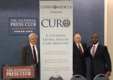 David E. Wilson, Michael J. O'Dea, and Louis Brown Jr. introduce Christ Medicus Foundation CURO. Photo via Sally Morrow/RNS.