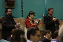 Reporters listen as cardinals speak to the press in the Vatican Tuesday. Photo courtesy Religion News Service.