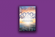 The cover of the book "2020s Foresight" shows the sky at sunrise and a city beneath it.