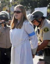 Stephanie Kimec joins Walmart workers and supporters at a Black Friday protest calling for fair wages.