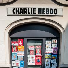 A Charlie Hebdo building with cartoons on the doors. Photo courtesy Brigitte Dja