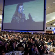 Scene from "Braveheart" is projected at the 2011 National Prayer Breakfast. 