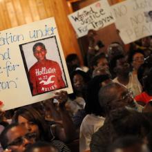 Residents attend to a town hall meeting 2/20 to discuss Martin's slaying. Getty 