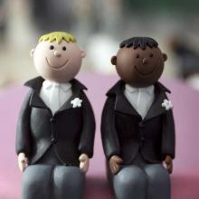 Wedding cake topper photo by Christopher Furlong/Getty Images.