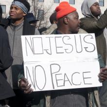 A protester holds a sign at the Justice for All march on Saturday in Washington.