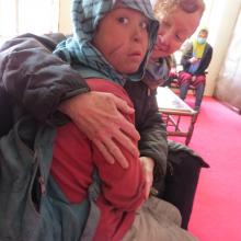 Kathy Kelly with Safar, an Afghan “street child”