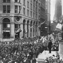 Crowds gather at the Subtreasury building on Wall Street for Armistice Day 1918
