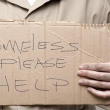 Homeless person asking for help, Kim Reinick / Shutterstock.com
