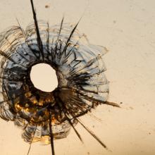 Gun shot in window, Iurii Konoval / Shutterstock.com