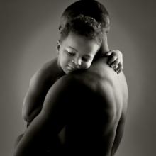 Father and son embrace. Photo courtesy stefanolunardi/shutterstock.com