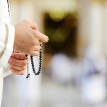 Praying illustration,  Zurijeta / Shutterstock.com
