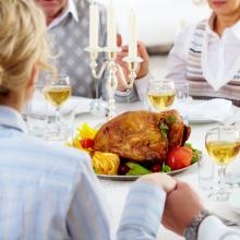 Photo: Family holiday meal, © Pressmaster / Shutterstock.com