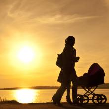 Women with baby carriage, vonzolomon / Shutterstock.com