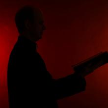 Young pastor with Bible silhouette, Africa Studio / Shutterstock.com
