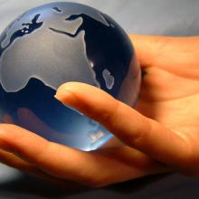 Globe in hand,  Magdalena Bujak / Shutterstock.com